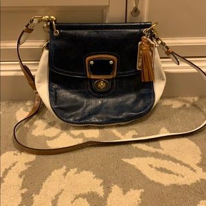 White and navy crossbody Coach purse